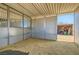 Spacious horse stall with sawdust bedding, and an attached storage area for equipment and supplies at 4075 W Torino Ave, Las Vegas, NV 89139