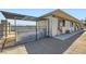 Horse stalls with functional design, offering shelter and access to an outdoor area for livestock at 4075 W Torino Ave, Las Vegas, NV 89139