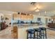 Open kitchen with granite counters, stainless appliances, and breakfast bar with comfortable seating at 4075 W Torino Ave, Las Vegas, NV 89139
