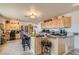 Spacious kitchen with granite counters, stainless appliances, and breakfast bar with seating at 4075 W Torino Ave, Las Vegas, NV 89139