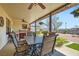 Spacious covered patio includes an outdoor dining area and peaceful backyard views at 4075 W Torino Ave, Las Vegas, NV 89139