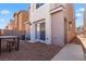 Private backyard area with low-maintenance gravel, perfect for outdoor dining or relaxing, featuring a small table set at 4076 Rocky Beach Dr, Las Vegas, NV 89115
