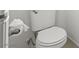 Close up view of the toilet and toilet paper holder inside a bright bathroom at 4076 Rocky Beach Dr, Las Vegas, NV 89115