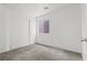 Well-lit bedroom showcasing carpet flooring, a big window, and a closet at 4076 Rocky Beach Dr, Las Vegas, NV 89115