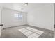Spacious bedroom featuring neutral carpet, natural light, and simple decor at 4076 Rocky Beach Dr, Las Vegas, NV 89115