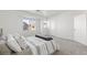 Bright bedroom features neutral tones, plush carpet, and a sunny window for natural light at 4076 Rocky Beach Dr, Las Vegas, NV 89115