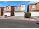 Charming townhomes featuring well-maintained landscaping and attached two-car garages, perfect for modern living at 4076 Rocky Beach Dr, Las Vegas, NV 89115