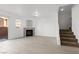 Inviting living area with fireplace, staircase, and sliding door, filled with natural light at 4076 Rocky Beach Dr, Las Vegas, NV 89115