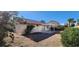 The backyard features a patio with pergola, landscaping, and a low-maintenance desert style yard at 4308 Apex Dr, Las Vegas, NV 89147