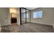 Cozy bedroom featuring tile floors, closet with mirror doors, and an ensuite bathroom at 4308 Apex Dr, Las Vegas, NV 89147