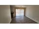 Bright dining area with wood-look tile flooring and sliding glass doors to the backyard at 4308 Apex Dr, Las Vegas, NV 89147
