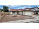 Charming single-story home with a red-tile roof, two-car garage, and low maintenance desert landscaping at 4308 Apex Dr, Las Vegas, NV 89147