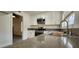 Well-lit kitchen with stainless steel appliances, modern countertops, and a stainless steel sink at 4308 Apex Dr, Las Vegas, NV 89147