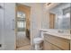 The bathroom with a walk-in shower and single sink vanity provides natural light at 4334 Libbiano Ct, Las Vegas, NV 89141