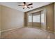A carpeted bedroom featuring a ceiling fan and a bay window provides lots of natural light at 4334 Libbiano Ct, Las Vegas, NV 89141