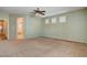 Large bedroom with neutral paint and carpet, offering a comfortable retreat at 4334 Libbiano Ct, Las Vegas, NV 89141