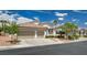 Inviting single-story home with a tile roof, a two-car garage, and desert landscaping in a quiet neighborhood at 4334 Libbiano Ct, Las Vegas, NV 89141