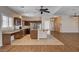 View of an open concept kitchen with stainless appliances, a center island, and breakfast bar at 4334 Libbiano Ct, Las Vegas, NV 89141