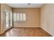 Bright living room features a window and glass doors providing plenty of natural light at 4334 Libbiano Ct, Las Vegas, NV 89141