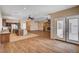 Open concept living room boasts an island, fireplace, and seamless flow to the kitchen at 4334 Libbiano Ct, Las Vegas, NV 89141