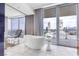This opulent bathroom features a luxurious soaking tub and stunning city views at 4381 W Flamingo Rd # 1102/1104, Las Vegas, NV 89103