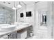 Modern bathroom features dual sinks, large mirror, and sleek marble and cabinets at 4381 W Flamingo Rd # 1102/1104, Las Vegas, NV 89103