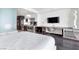 Modern studio featuring dark hardwood floors, a sleek kitchenette, and a comfortable sleeping area at 4381 W Flamingo Rd # 1102/1104, Las Vegas, NV 89103