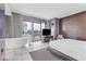 Bright bedroom features a soaking tub, large windows and balcony with city views at 4381 W Flamingo Rd # 1102/1104, Las Vegas, NV 89103