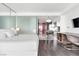 Bright bedroom with a plush bed, seamless transition to the modern kitchen, and sleek design elements at 4381 W Flamingo Rd # 1102/1104, Las Vegas, NV 89103
