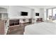 Contemporary bedroom with desk area, sleek design, and city views through large windows at 4381 W Flamingo Rd # 1102/1104, Las Vegas, NV 89103