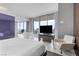 Airy bedroom boasts a soaking tub, seating area, and balcony access with city views at 4381 W Flamingo Rd # 1102/1104, Las Vegas, NV 89103