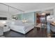 Bright bedroom with a full mirrored wall, with light-colored furnishings and a view into the kitchenette at 4381 W Flamingo Rd # 1102/1104, Las Vegas, NV 89103