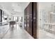 Hallway leading to the bedroom with large closet, and a full bathroom with double sink at 4381 W Flamingo Rd # 1102/1104, Las Vegas, NV 89103