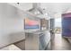 Modern kitchen with stainless steel island, bar seating, and city views at 4381 W Flamingo Rd # 1102/1104, Las Vegas, NV 89103