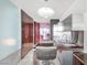 Contemporary kitchen featuring stainless steel appliances, modern cabinetry, and a compact dining area at 4381 W Flamingo Rd # 1102/1104, Las Vegas, NV 89103