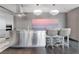 Modern kitchen featuring stainless steel island, modern appliances, and barstool seating at 4381 W Flamingo Rd # 1102/1104, Las Vegas, NV 89103