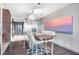 Modern kitchen features a dining area with stylish pendant lighting and stainless steel appliances at 4381 W Flamingo Rd # 1102/1104, Las Vegas, NV 89103