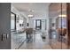 Stylish kitchen with stainless steel appliances, overhead lighting, and seamless transition to the bedroom at 4381 W Flamingo Rd # 1102/1104, Las Vegas, NV 89103