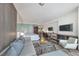 Bright living room featuring modern decor, entertainment area, and open floor plan with city views at 4381 W Flamingo Rd # 1102/1104, Las Vegas, NV 89103