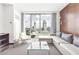 Modern living room with floor-to-ceiling windows and a panoramic city view at Palms Place at 4381 W Flamingo Rd # 1102/1104, Las Vegas, NV 89103