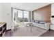 Chic living room with a plush sofa, stylish decor, and expansive windows overlooking the city at 4381 W Flamingo Rd # 1102/1104, Las Vegas, NV 89103