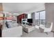 Bright and airy living room showcases city views, comfortable seating, and an open layout at 4381 W Flamingo Rd # 1102/1104, Las Vegas, NV 89103