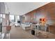 Spacious living room boasts modern decor, comfortable seating, and city views through large windows at 4381 W Flamingo Rd # 1102/1104, Las Vegas, NV 89103
