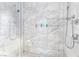 Contemporary shower with marble tile, dual shower heads, and built in shampoo niche at 4381 W Flamingo Rd # 1102/1104, Las Vegas, NV 89103