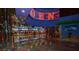 Wide view of the casino bar area with colorful floor and decorative lighting at 4381 W Flamingo Rd # 2302, Las Vegas, NV 89103