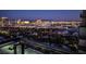 A nighttime panorama of the city skyline, showcasing illuminated buildings, from a high vantage point at 4381 W Flamingo Rd # 2302, Las Vegas, NV 89103