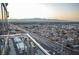 Elevated view showing city, streets and mountains under the sun from balcony at 4381 W Flamingo Rd # 2302, Las Vegas, NV 89103
