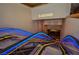 Casino escalator with blue and yellow lights leading to the gaming floor at 4381 W Flamingo Rd # 2302, Las Vegas, NV 89103
