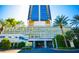 Elegant building exterior with grand entrance, landscaping, and Palms Place signage at 4381 W Flamingo Rd # 2302, Las Vegas, NV 89103