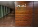 View of a casino hallway with wood-patterned wall and sign for the Palms Sky Tube at 4381 W Flamingo Rd # 2302, Las Vegas, NV 89103
